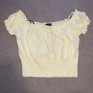 A yellow flowered Cropped shirt